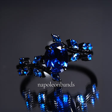 "Midnight Bloom" – Blue Sapphire Black Engagement Ring with Sapphire Leaf Accents
