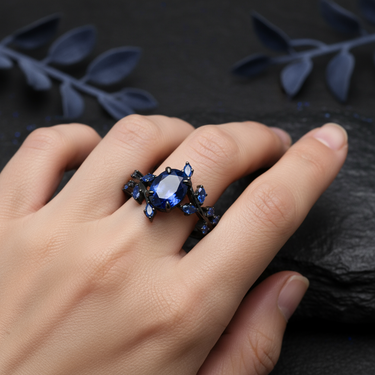 "Midnight Bloom" – Blue Sapphire Black Engagement Ring with Sapphire Leaf Accents